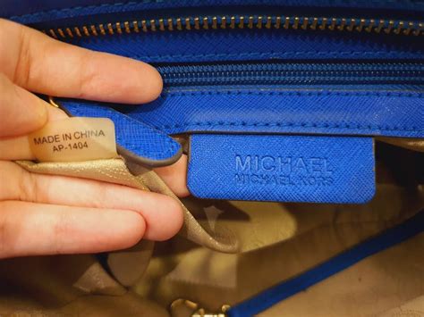 how to tell if a michael kors bag is real|michael kors serial number checker.